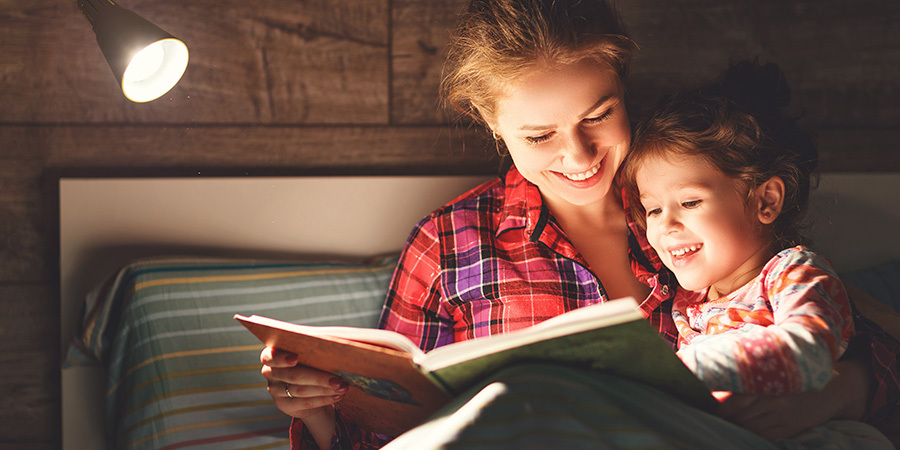 Family Reading Under Warm Lamp Light