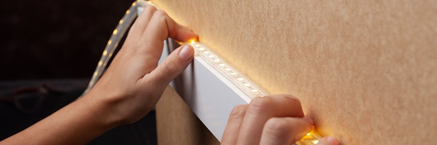 Weekend Ideas: DIY LED Light Strip Projects A person installing a DIY LED light strip project