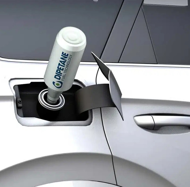 Pouring Dipetane fuel treatment into a car fuel tank