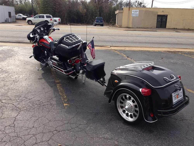 Motorcycle hauling a Heritage trailer