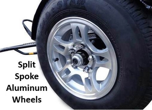 Trinity MT3 trailer carrying three motorcycles, equipped with split-spoke aluminum wheels.

