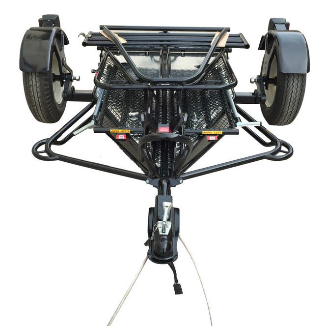 Alpha Sport Stand-Up Motorcycle Trailer in vertical storage position showing its compact, foldable design.