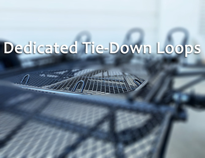 Close-up of dedicated rear tie-down loops on the Freestyle dirt bike trailer for secure bike transport.