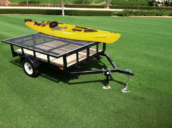 Utility & Motorcycle Camper Trailer Carrying a Kayak