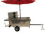 The Big One hot dog cart side view with red umbrella