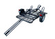 Front angled view of the Freestyle dirt bike trailer showcasing its durable frame and wheel chocks.