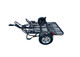 Side view of Freestyle dirt bike trailer in open position, showing mesh deck and rail system.