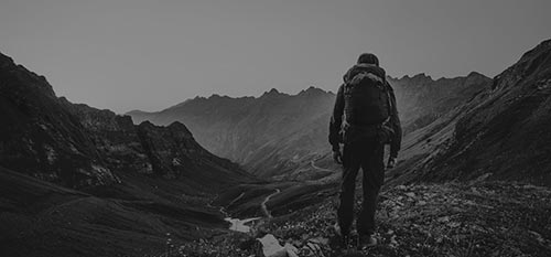 Man walking through valley