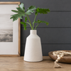 Minimalist vase with greenery and texture