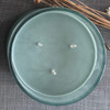 An overhead, top-down view of the unlit candle, showing the three lead-free wicks evenly placed in the smooth, sage green soy wax.