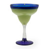 An angled view of the La Playa candle against a white background, highlighting the vibrant colors of the wax and the classic cocktail glass shape.