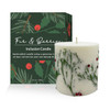 Fir & Berry Inclusion Candle beside its green winter forest gift box on a tabletop