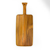 A teak paddle board shown vertically, with grapes and cheese, emphasizing its overall design and natural wood grain.