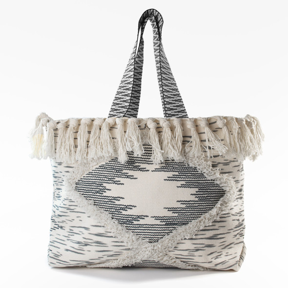 The stylish Lola Tassels Large Boho Tote, featuring a chic black and white woven pattern with oversized fringe and tassels, is shown against a plain white background. The stylish Lola Tassels Large Boho Tote, featuring a chic black and white woven pattern with oversized fringe and tassels, is shown against a plain white background.