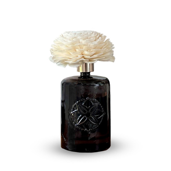 A clear, isolated product shot of the Flower Reed Diffuser against a plain white background, showing the complete piece with the dark glass bottle and the sola flower reed. A clear, isolated product shot of the Flower Reed Diffuser against a plain white background, showing the complete piece with the dark glass bottle and the sola flower reed.
