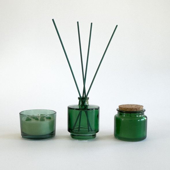 A clear, isolated product shot of the Green Glass Diffuser & Candles Set against a plain white background, showing all three matching pieces. A clear, isolated product shot of the Green Glass Diffuser & Candles Set against a plain white background, showing all three matching pieces.