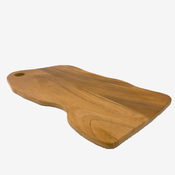 A side view of the natural edge walnut wood cutting board, highlighting its thickness and smooth finish. A side view of the natural edge walnut wood cutting board, highlighting its thickness and smooth finish.