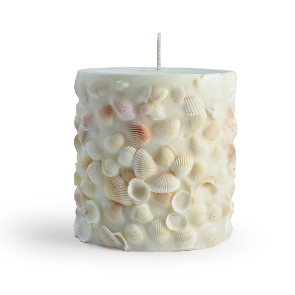 Another angle of the isolated seashell candle against a white background, showcasing its unique, hand-crafted pillar shape.