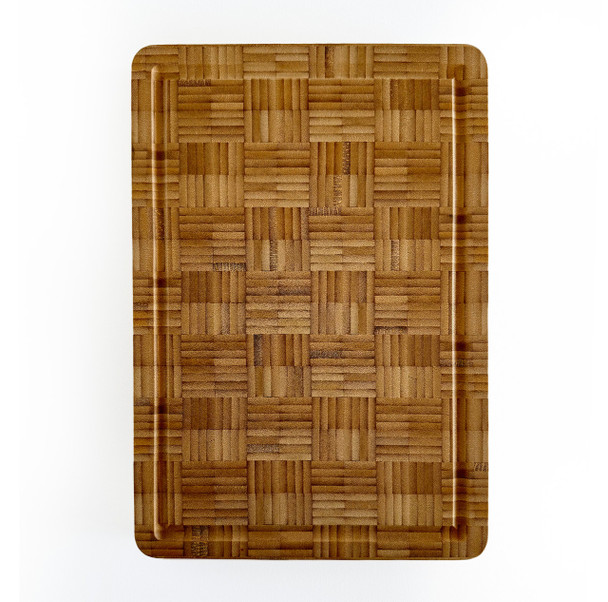 A rectangular bamboo end grain cutting board viewed from above, highlighting its surface pattern and clean lines.