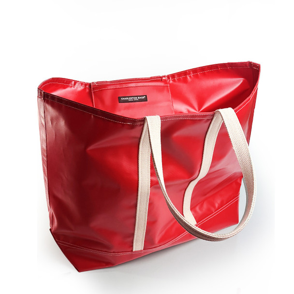 Cherry-red Stono tote on tabletop—front view with khaki straps.