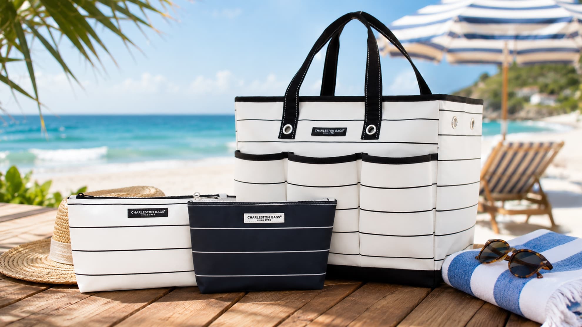 Coordinating Charleston Bags totes and travel pouches styled at the beach