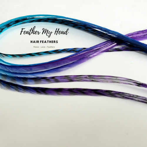 Hair Feathers dyed with multiple colors on one feather for a tie dye, rainbow effect in tones of purple and blue. We have the long lengths you will love and our optional feather kit makes installing our hair feathers yourself a breeze.