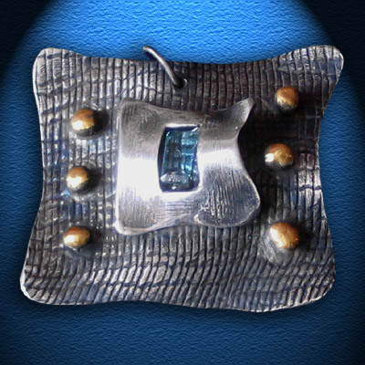 PEACE OF MIND SILVER PENDANT WITH BLUE TOPAZ