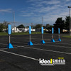 Row of blue portable sign bases with vertical posts in a parking lot, used for temporary directional signage and traffic or parking organization