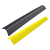 Two ribbed decorative bollard covers in black and yellow polyethylene, designed to slide over steel posts for added protection and visibility