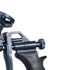 Close-up view of the flow adjustment knob and trigger mechanism on a dark grey spray foam gun.