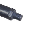 Extreme close-up of the textured grey nozzle tip at the end of a spray foam gun barrel.