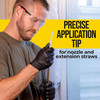 Contractor attaching a plastic extension straw tip onto the nozzle of a foam applicator gun.
