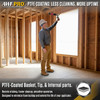 Contractor reaching overhead with an extended barrel spray foam gun inside framed construction structure.