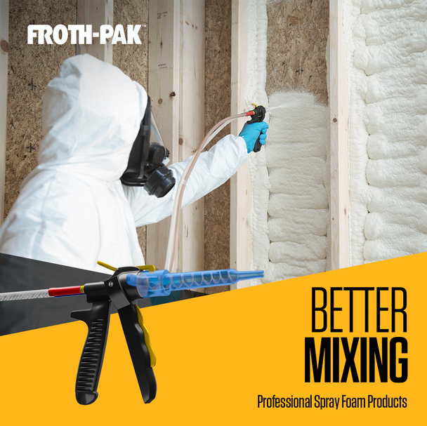 Contractor in a protective suit and respirator applying spray foam insulation to open wall studs for a seamless seal.