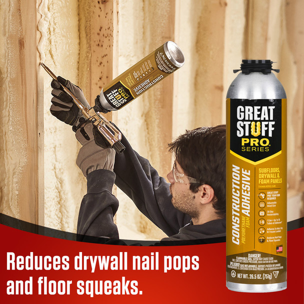 Contractor using a foam dispensing gun to apply construction adhesive to wall studs to reduce drywall nail pops.