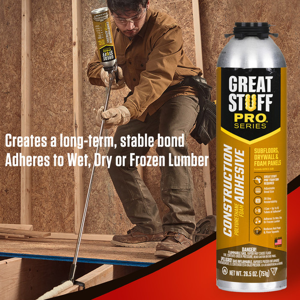 Contractor using a long applicator gun to apply construction adhesive to subfloor framing to create a stable bond.