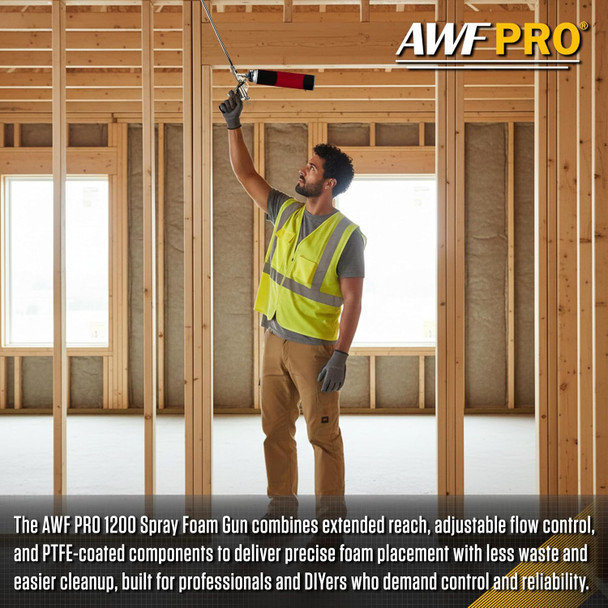 Contractor reaching overhead with extended spray foam gun inside wood-framed room.