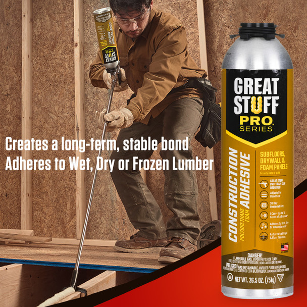 Contractor using a long applicator gun to apply construction adhesive to subfloor framing to create a stable bond.