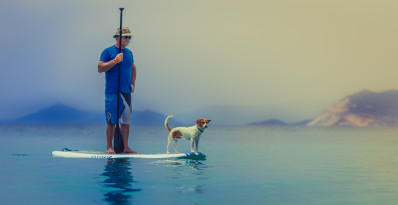 A man and his best friend on his SUP board