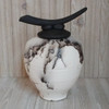 Dramatic black and white horse hair vessel with unique artistic top.  150 cubic inch capacity. Available as a custom order.