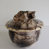 handmade urn with sleeping cat made using a horse hair process