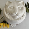 White cat's face on ceramic cat urn
