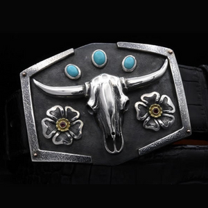 Sterling Silver & 18K Steer Skull with Stones Buckle. This unique buckle features a detailed steer skull design adorned with stones for a touch of sparkle. JWCooper.com