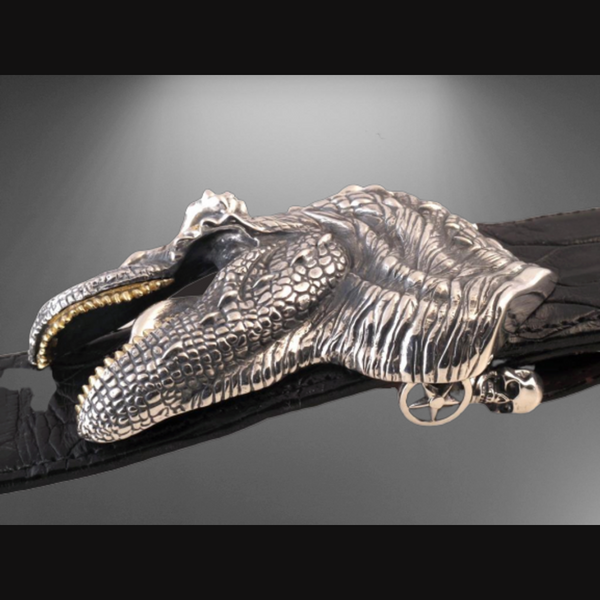 T Rex Sterling Silver & 18K Gold Buckle. This unique buckle showcases a fearsome T Rex design in sterling silver, complemented by 18K gold accents. JWCooper.com