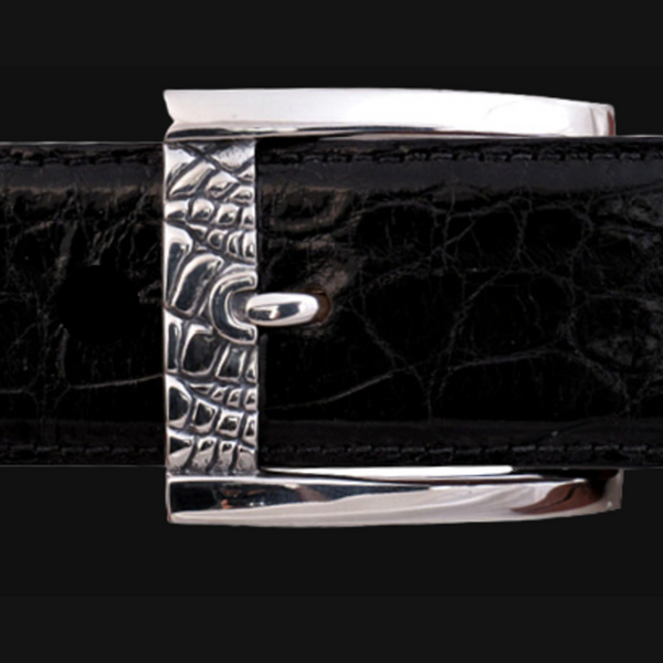 Sterling Silver Buckle featuring an eye-catching alligator print design. Crafted with meticulous attention to detail, this buckle showcases the intricate texture and pattern of alligator skin, adding a touch of rugged sophistication to your belt collection. JWCooper.com