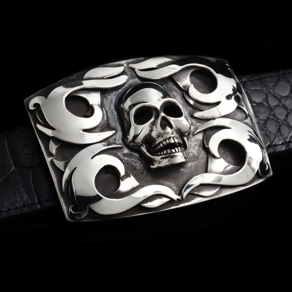 A Sterling Skull with Tribal Overlay Scrolls Buckle - a bold statement piece that showcases intricate tribal-inspired designs and a striking skull centerpiece. Perfect for those who embrace edgy and unique style. JWCooper.com
