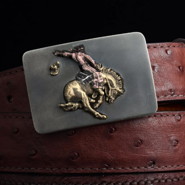 Sterling Silver & 3-Color 14K Gold Bronc Rider Buckle 1 1/2". This heavy gauge buckle showcases a captivating bronc rider made of 3-color 14K gold. JWCooper.com