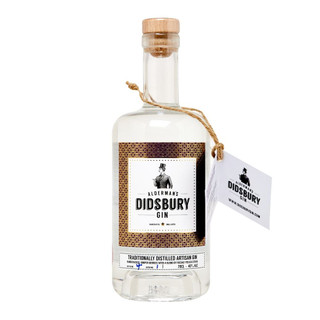 A single transparent bottle with a cork closure, the Didsbury Gin name is central against a multicoloured background.