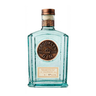 A single pale blue-hued bottle with a copper coloured wax stamp in the centre, embossed with the Brooklyn Gin name.