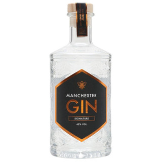 A single transparent bottle embossed with geometric shapes, the Manchester Gin name is written inside a mate black hexagon.